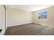 Carpeted bedroom filled with sunlight from a large window at 356 Gulfport Ct, Las Vegas, NV 89145