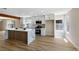 Contemporary kitchen showcasing a waterfall island, stainless steel appliances, and white cabinetry at 356 Gulfport Ct, Las Vegas, NV 89145
