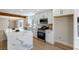 Updated kitchen featuring a waterfall island, modern appliances, and ample counter space at 356 Gulfport Ct, Las Vegas, NV 89145