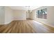 Inviting living room with wood-look tile floors, and lots of natural light from the oversized windows at 356 Gulfport Ct, Las Vegas, NV 89145