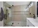 Modern shower stall showcasing tile walls, glass doors, and sleek fixtures at 356 Gulfport Ct, Las Vegas, NV 89145