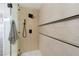 Close-up of tiled shower with modern fixtures and glass door at 356 Gulfport Ct, Las Vegas, NV 89145