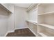 Spacious walk-in closet with shelving and hanging rods offers ample storage space at 356 Gulfport Ct, Las Vegas, NV 89145