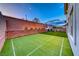 Backyard with a turf lawn and playground at 365 Crown Mesa Ave, Las Vegas, NV 89138