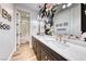 This bathroom features double sinks, a large mirror, and stylish fixtures for a luxurious experience at 365 Crown Mesa Ave, Las Vegas, NV 89138