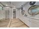 Elegant bathroom features double vanities, a glass-enclosed shower, and a walk-in closet at 365 Crown Mesa Ave, Las Vegas, NV 89138