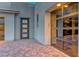 Modern home featuring a glass garage door and a stylish, five-panel front door at 365 Crown Mesa Ave, Las Vegas, NV 89138