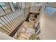 Spacious foyer features a modern chandelier, staircase with iron railing, and stylish decor at 365 Crown Mesa Ave, Las Vegas, NV 89138