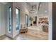 Bright, modern foyer with tall ceilings, large windows, and an open floor plan leading to the kitchen at 365 Crown Mesa Ave, Las Vegas, NV 89138