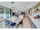 Open-concept design highlights the kitchen with an island, modern appliances, and a dining table perfect for Gathering gatherings at 365 Crown Mesa Ave, Las Vegas, NV 89138