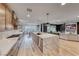 Bright and open kitchen with an island, stainless steel appliances, and seamless flow into dining and living spaces at 365 Crown Mesa Ave, Las Vegas, NV 89138