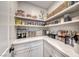 Organized walk-in pantry with marble countertops and open shelving, perfect for storing all your kitchen essentials at 365 Crown Mesa Ave, Las Vegas, NV 89138
