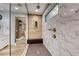 Luxurious shower with a glass surround, rainfall shower head, and a stylish bench for ultimate relaxation at 365 Crown Mesa Ave, Las Vegas, NV 89138