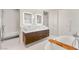 Elegant bathroom with double sinks, a soaking tub, and a walk-in shower at 3750 Las Vegas Blvd # 3006, Las Vegas, NV 89158