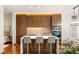 Modern kitchen features wood cabinetry, a center island with seating, and stainless steel appliances at 3750 Las Vegas Blvd # 3006, Las Vegas, NV 89158