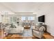 Bright living room features comfortable seating and city views at 3750 Las Vegas Blvd # 3006, Las Vegas, NV 89158
