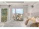 Luxurious bedroom featuring city views, floor-to-ceiling windows, and a comfortable canopy bed at 3750 Las Vegas Blvd # 3006, Las Vegas, NV 89158