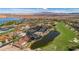 A serene neighborhood with luxurious houses next to a golf course and lake overlooking the desert at 38 Grand Miramar Dr, Henderson, NV 89011