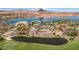 Stunning aerial view of a golf course, lake, and luxury homes surrounded by desert scenery at 38 Grand Miramar Dr, Henderson, NV 89011