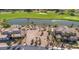 Aerial view of a beautiful vacant lot with golf course and lake views; palm trees dot the property at 38 Grand Miramar Dr, Henderson, NV 89011