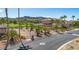A peaceful streetscape with palm trees and greenery, leading to gorgeous homes in a serene setting at 38 Grand Miramar Dr, Henderson, NV 89011