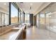 Bright bathroom featuring a long vanity with dual sinks, soaking tub and glass enclosed shower at 4 Horseshoe Rock Ct, Henderson, NV 89012