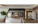 Spacious indoor/outdoor dining and kitchen featuring stainless steel appliances, bar seating and modern design at 4 Horseshoe Rock Ct, Henderson, NV 89012