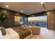 Spacious main bedroom with views and access to an outdoor lounge with fireplace and seating at 4 Horseshoe Rock Ct, Henderson, NV 89012