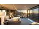 Luxury main bedroom with city views, sitting area, and an adjacent kitchenette at 4 Horseshoe Rock Ct, Henderson, NV 89012