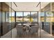 Modern office with glass walls showcasing stunning mountain views and contemporary decor at 4 Horseshoe Rock Ct, Henderson, NV 89012
