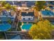 Aerial view of the backyard featuring a sparkling swimming pool and well-maintained green lawn at 4046 Bridgeview Cir, Las Vegas, NV 89147