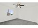 Bright bedroom features neutral walls, ceiling fan, and a window offering a serene and comfortable living space at 4046 Bridgeview Cir, Las Vegas, NV 89147