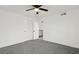 Neutral bedroom features ceiling fan and access to another room creating a peaceful and comfortable living space at 4046 Bridgeview Cir, Las Vegas, NV 89147