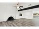 Bright living room with a cozy fireplace and ample space for gatherings at 4046 Bridgeview Cir, Las Vegas, NV 89147
