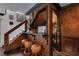 Stylish basement bar area with comfortable seating and a view of the staircase, perfect for entertaining guests at 4108 Royal Scots Ave, Las Vegas, NV 89141