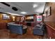 Basement living area with a projector, comfortable seating, and a large TV, ideal for movie nights at 4108 Royal Scots Ave, Las Vegas, NV 89141
