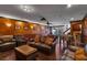 Spacious basement with a pool table, foosball table, and comfortable seating area for entertainment and relaxation at 4108 Royal Scots Ave, Las Vegas, NV 89141