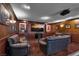 Basement entertainment area with a large television and comfortable seating, creating an inviting atmosphere at 4108 Royal Scots Ave, Las Vegas, NV 89141