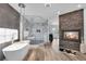 Stunning bathroom with a soaking tub, a fireplace, and a glass shower at 4108 Royal Scots Ave, Las Vegas, NV 89141