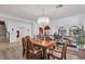 Bright dining room featuring an elegant chandelier, hardwood floors, and beautiful second story view at 4108 Royal Scots Ave, Las Vegas, NV 89141