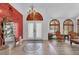 Grand foyer with high ceilings, decorative tile flooring, a chandelier, and views of the formal living area at 4108 Royal Scots Ave, Las Vegas, NV 89141