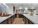 Kitchen featuring stainless steel apron sink, stone backsplash, and updated appliances at 4108 Royal Scots Ave, Las Vegas, NV 89141