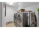 Functional laundry room with modern washer and dryer, offering convenience and efficiency at 4108 Royal Scots Ave, Las Vegas, NV 89141