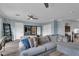 Bright living room features a large sectional couch and updated floors at 4108 Royal Scots Ave, Las Vegas, NV 89141