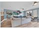 Stylish living room has a large sectional couch and mounted entertainment center at 4108 Royal Scots Ave, Las Vegas, NV 89141