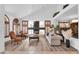 Bright and airy living room with a fireplace, high ceilings, shuttered windows, and stylish furniture at 4108 Royal Scots Ave, Las Vegas, NV 89141