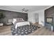 Spacious main bedroom with a fireplace, ceiling fan, and modern finishes at 4108 Royal Scots Ave, Las Vegas, NV 89141