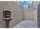 Small outdoor patio featuring a water fountain, offering a tranquil and private outdoor space at 4108 Royal Scots Ave, Las Vegas, NV 89141