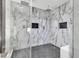 Luxurious shower featuring marble tiling, dual shower heads, and glass enclosure at 4108 Royal Scots Ave, Las Vegas, NV 89141