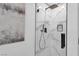 Contemporary glass shower with rainfall shower head and elegant marble-style tile, a perfect blend of style and function at 4108 Royal Scots Ave, Las Vegas, NV 89141